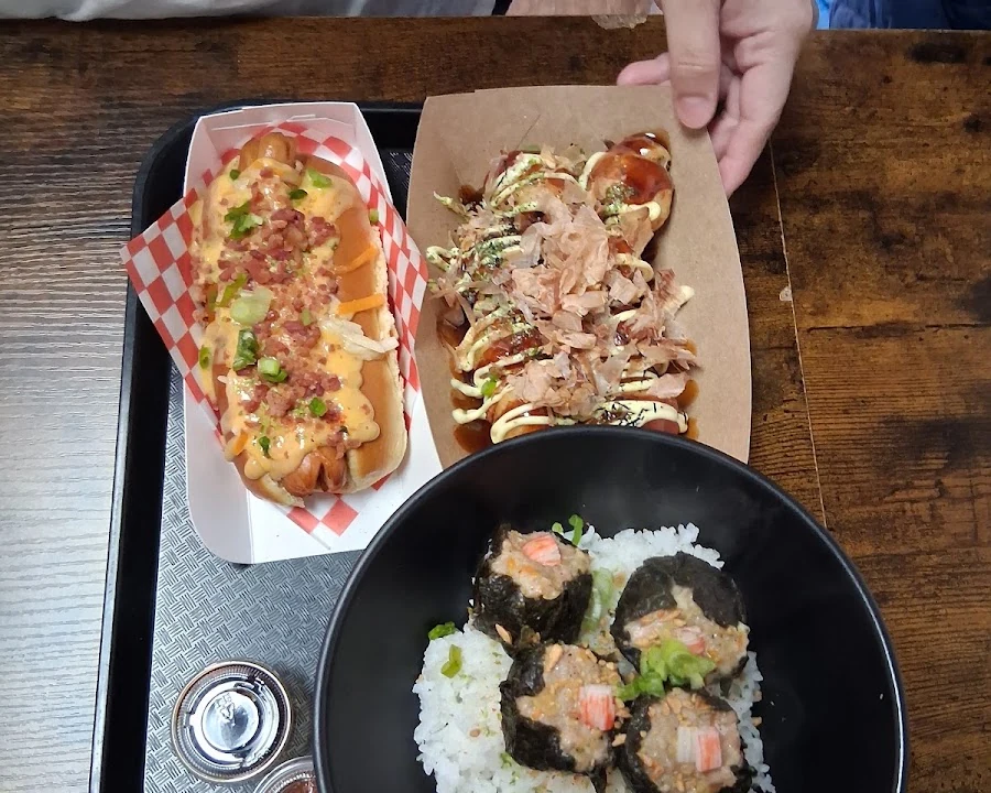 Fresh takoyaki cooking on the griddle at Takoyami in Calgary NE